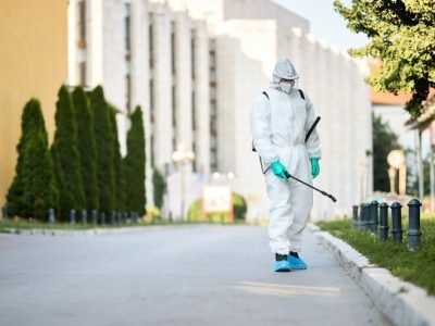 man-protective-suit-disinfecting-city-streets-coronavirus-pandemic_637285-7908