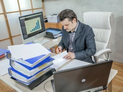 young-businessman-working-from-his-office-concept-hard-work_181624-26431